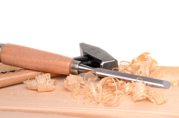 Photo carpenter tools hammer and chisel on white background