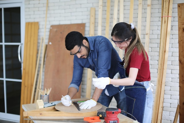 Carpenter or warehouse worker choosing raw wood material for the work at the carpentry storage