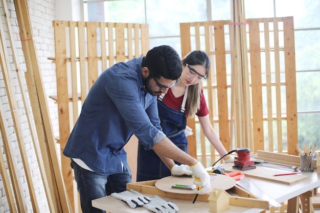 Carpenter or warehouse worker choosing raw wood material for the work at the carpentry storage