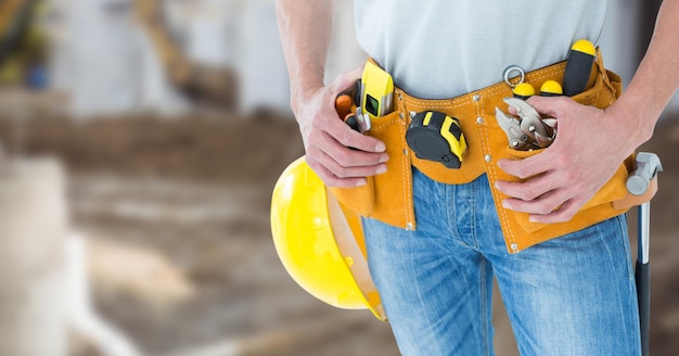 Carpenter with tools on building site