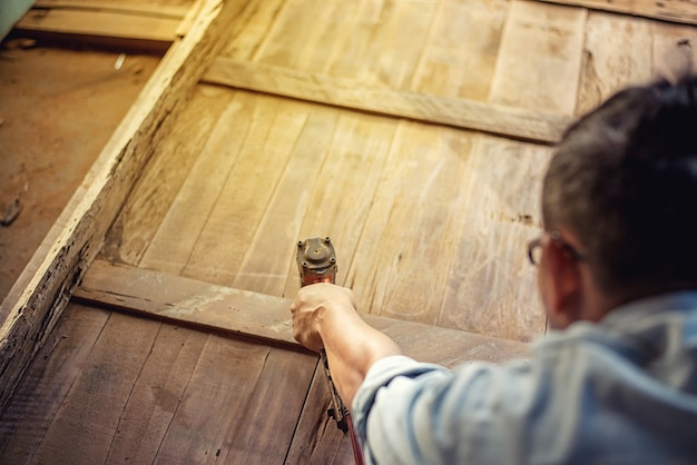 Carpenter Woodwork and furniture making in carpentry workshop