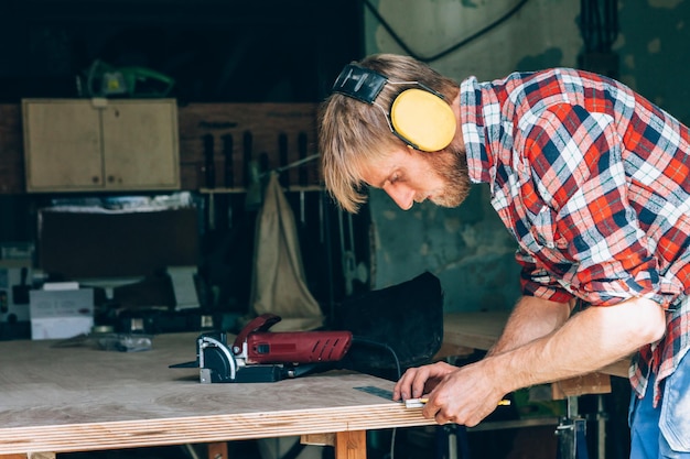 Carpenter at work in his workshop