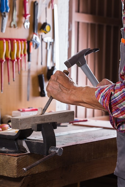 Carpenter working on the work bench joinery tools and woodwork