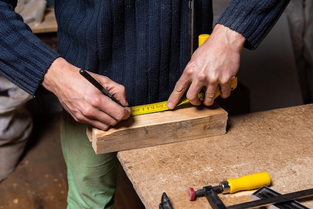 A carpenter works in a furniture workshop