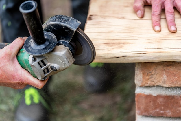 A carpenter works in a garden