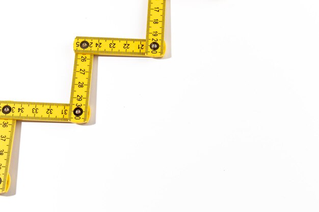 A carpenters ruler on white background