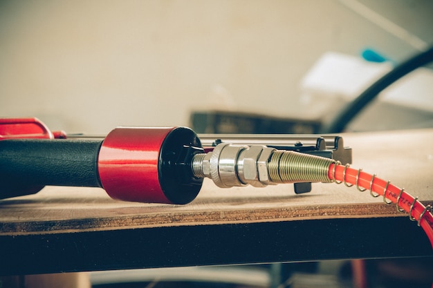 Carpentry tools - nailing gun  on a workbench