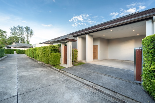 Carport of luxury pool villa and small wooden gate