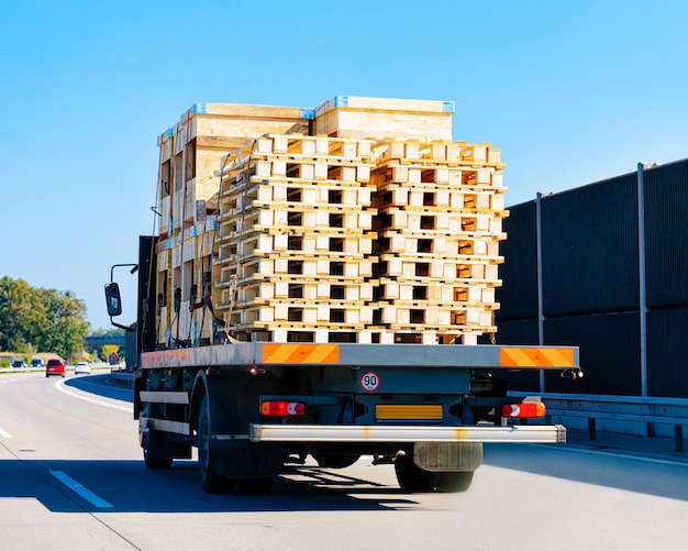 Carrier vessel in the highway road in Poland. Lorry transport delivering some freight cargo.