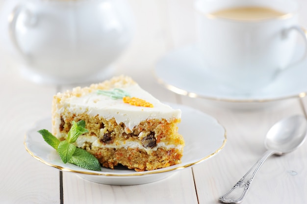 Carrot cake slice with mint and coffee