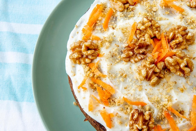 Carrot Cake with Cream Cheese Icing and walnuts - stock photo