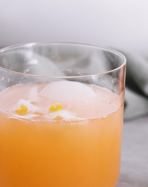 Carrot Cocktail in glass with cubes Ice