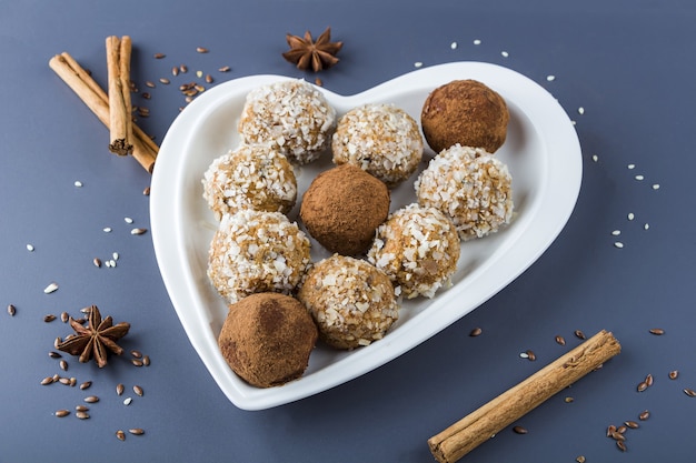 carrot energy balls with nuts, coconut flakes and raisins