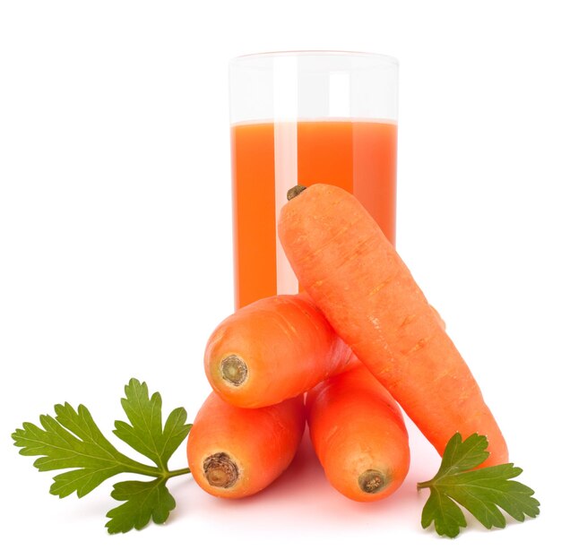 Carrot juice glass and carrot tubers