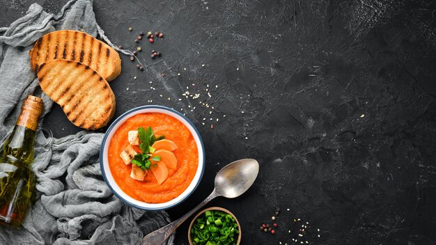 Carrot puree soup with toast bread Dietary food Top view Free copy space