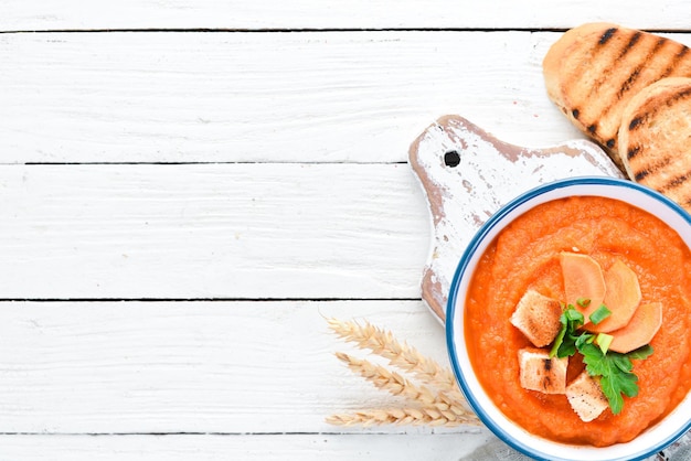 Carrot puree soup. with toast bread. Dietary food. Top view. Free copy space.