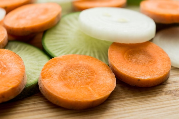 Carrot radish and onion on the wooden deck