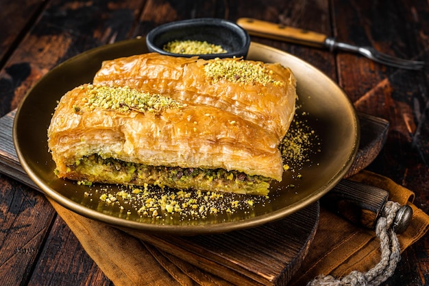 Carrot Slice Baklava Turkish Havuc Dilim Baklava with pistachio Wooden background Top view