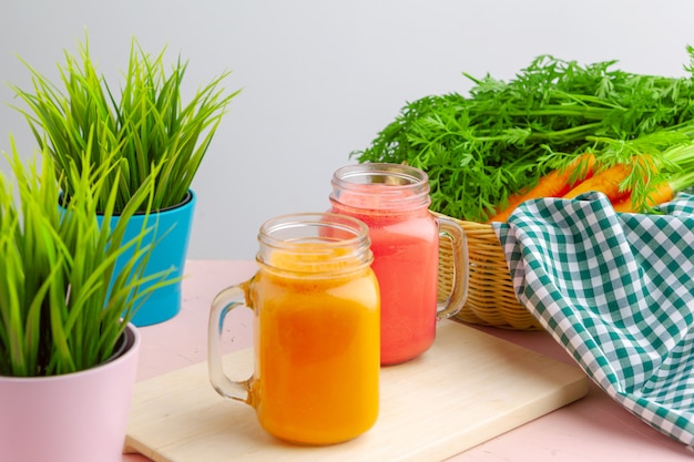 Carrot smoothie with parsley on a table