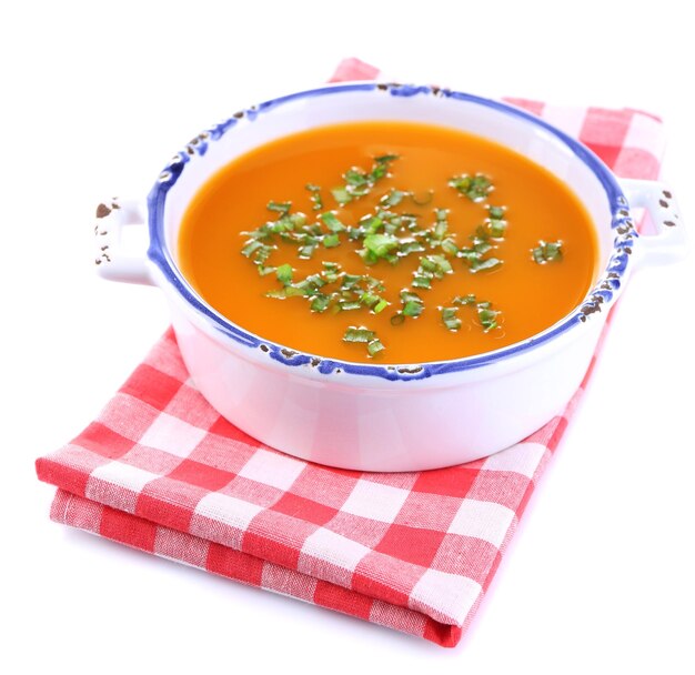 Carrot soup isolated on white