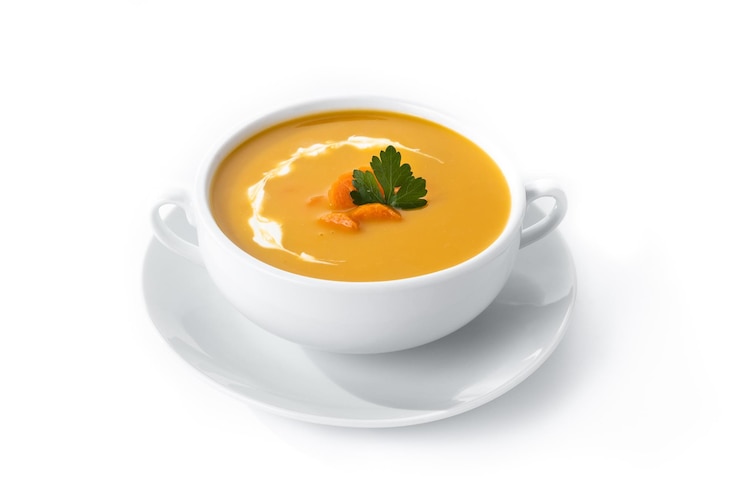 Photo carrot soup with cream and parsley