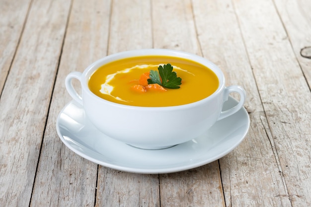 Carrot soup with cream and parsley