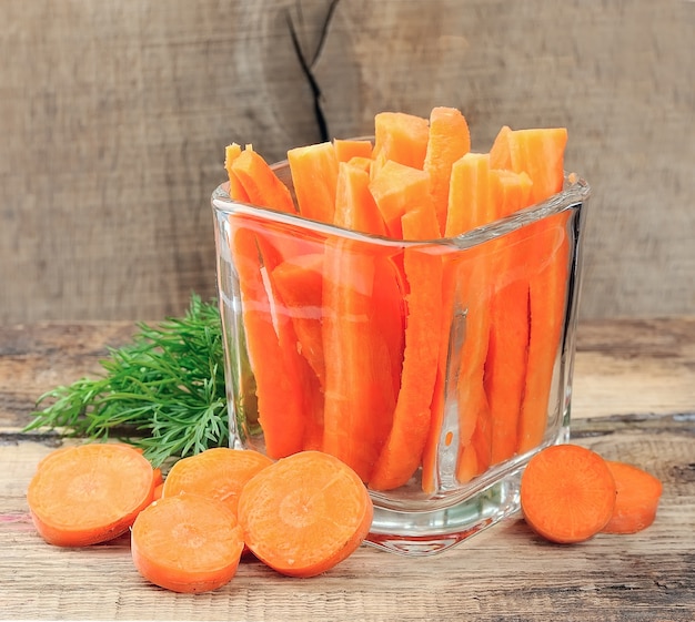 Carrots slices on wooden background