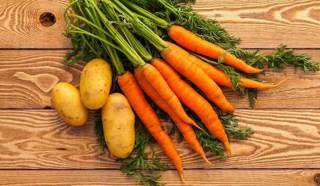 Carrots on a wooden background