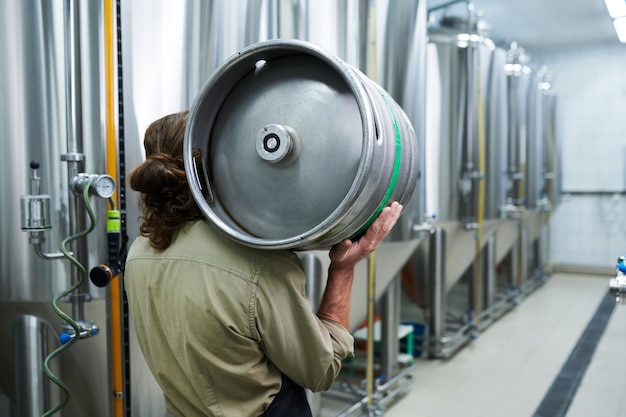 Carrying beer keg to warehouse