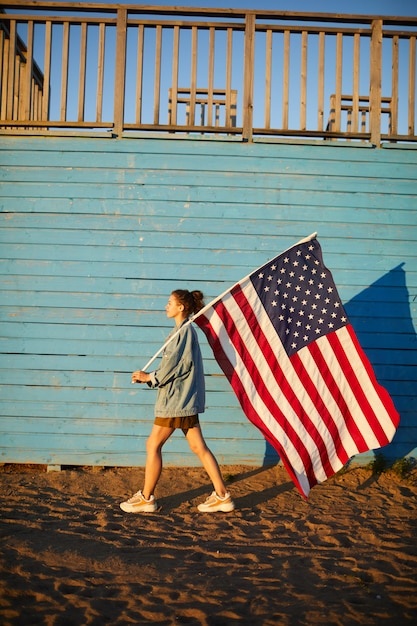 Carrying big American flag