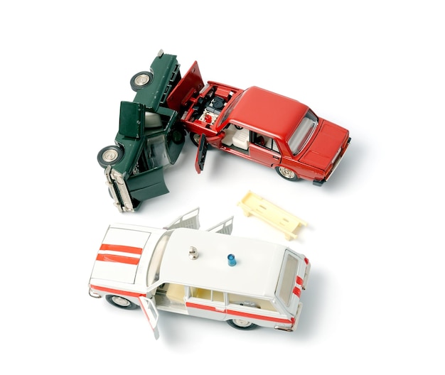 Cars in accident on a white background and ambulance car