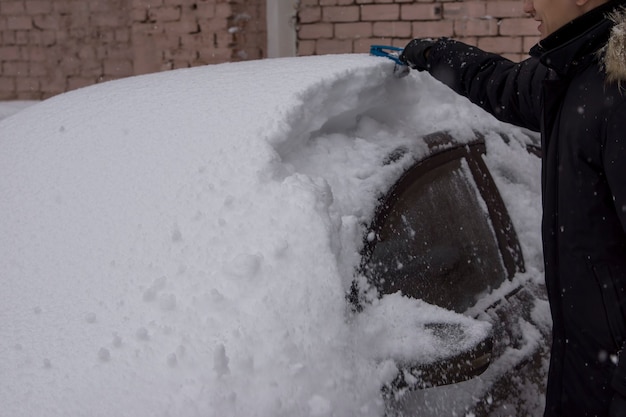 Cars after a snowfall. Windshield wiper raised up.