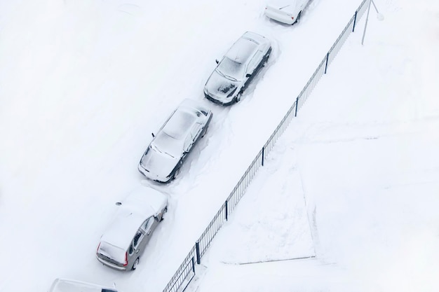 Cars covered with snow view from above