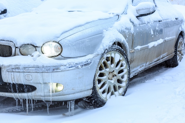 Cars covered with snow