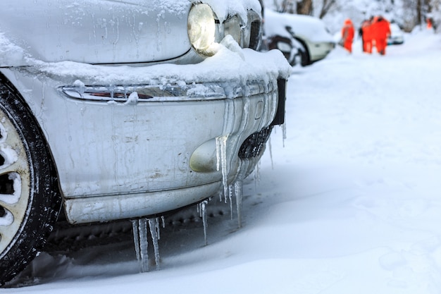 Cars covered with snow