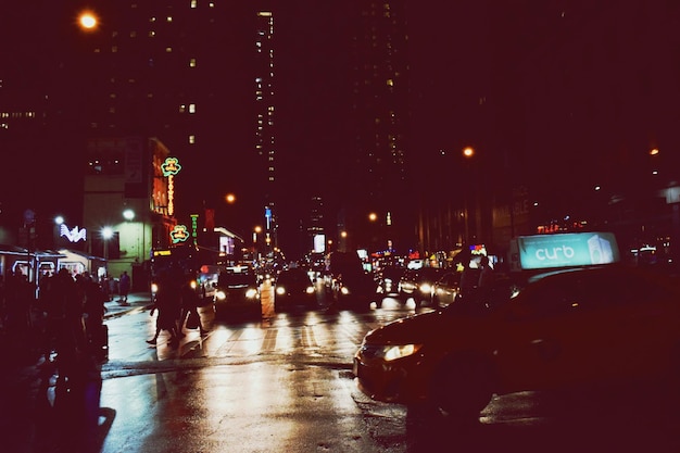 Cars on illuminated city at night