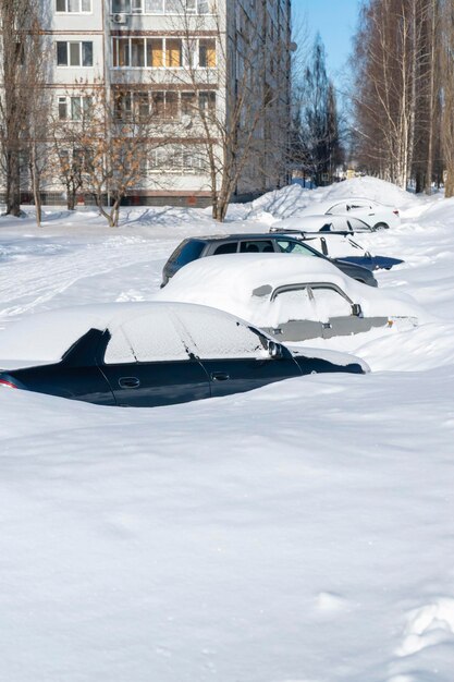 Cars parked after a blizzard. Russia