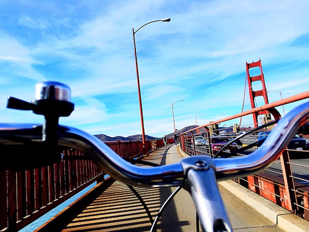 Cars on railing against sky