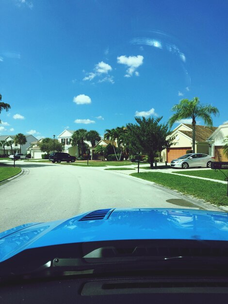 Cars on road against sky