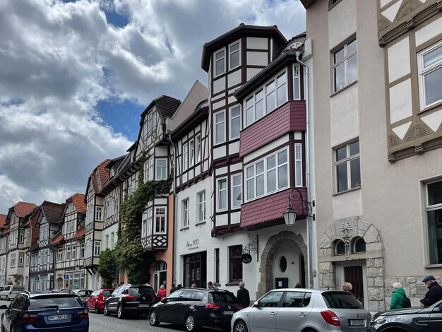 Cars on street against sky