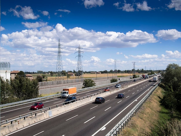 Cars trucks person and stocks on motorway