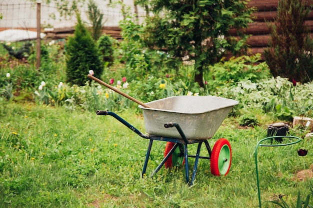 Photo cart for carrying cargo in the garden, tool for gardening and home farming.