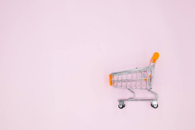 A cart on a pink background