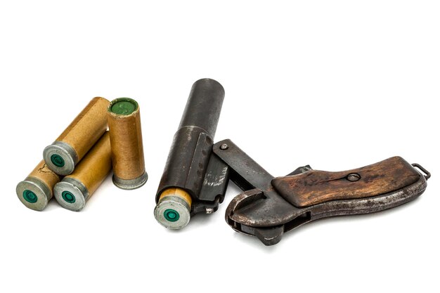 Photo cartridge is inserted into the barrel flare gun isolated on white background