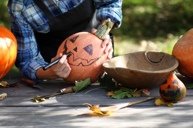 Carve pumpkins for Halloween