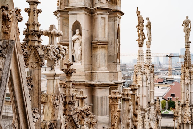 Carved spires on the roof of the duomo italy milan