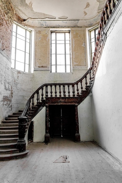 A carved wooden staircase in ancient palace