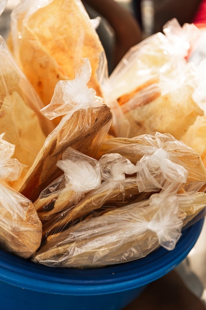 Casabe packed in plastic bags for sale Concept traditional food in Honduras