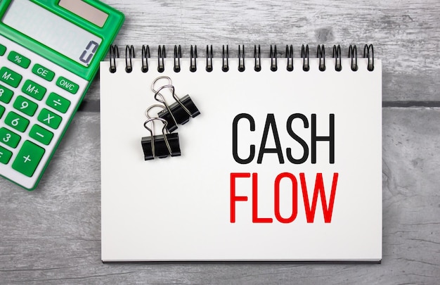 CASH FLOW text concept on notepad Financial business concept