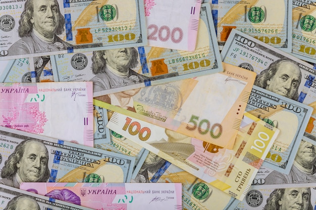 cash money finance investment american dollars banknotes and ukrainian money.